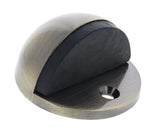Carbine Nidus Half Dome Floor Mounted Door Stop - Antique Brass